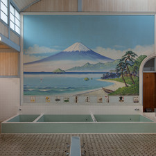 Kodakara-yu Public Bathhouse, Edo-Tokyo Open Air Architectural Museum (relocated from Adachi Ward, Tokyo). "This is a typical Tokyo public bath. It has luxurious features such as a large Chinese-style gable like those used for temples and shrines, carvings of the seven gods of good luck above the entrance, and a lattice ceiling in the dressing room. [Senju-motomachi, Adachi Ward, 1929]"